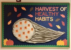 a bulletin board with an image of a hat made out of paper and words that read harvest of healthy habitts