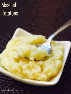 mashed potatoes in a white bowl with a spoon on top and text overlay