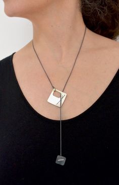 Every day is an opportunity to express who you are. That’s why we designed our Two-Layered Stitched Square Necklace to match your mood! Each Argentium silver square is stitched with fine silver and hangs from an oxidized silver rope chain with a clasp in the back. This versatile necklace can be worn with the small square hanging lower than the larger square or with the two squares nestled together. It’s up to you! Details: Oxidized Argentium silver Bright Argentium silver 22” Oxidized silver rop Silver Rope Chain, Fluid Design, Square Necklace, Jewelry Quotes, Necklace Clasps, Artful Home, Pearl Collection, Argentium Silver, Layered Jewelry