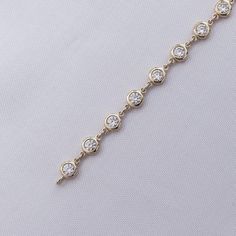 This exquisite 3 3/4 Carat round moissanite diamond necklace features a delicate link chain and a bezel-set design. Expertly crafted with lab-created diamonds in 10K or 14K solid gold and 925 sterling silver, this piece radiates luxury and sophistication. The perfect addition to elevate any outfit. Model No : CSSN1523 Timeless Cubic Zirconia Diamond Necklace With Adjustable Chain, Adjustable Bezel Set Cubic Zirconia Diamond Bracelet, Luxury Bezel-set Bracelet, Luxury Bezel-set Round Diamond Necklace, Adjustable Bezel-set Cubic Zirconia Jewelry, Round Moissanite, Diamond Bangle, Lab Created Diamonds, Chain Link Necklace