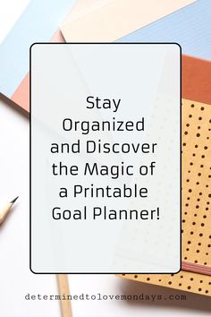 the words stay organized and discovering the magic of a printable goal planner on top of various stationery items