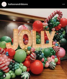 balloons, candy canes and lights spelling the word jolly