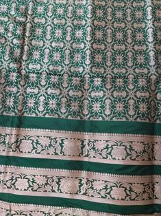 This Banarasi handloom pure silk lehenga is a perfect festive/wedding/occasional wear it enhanced with green color motifs.  Occasion: party wear/wedding  Materials. Pure silk. Unstich  Fabric design - Banarasi  lehenga  Pattern: paisley/buti motifs.  Borders: yes  Border type: Zari  Zari type: golden zari. Fabric length with blouse and with dupatta.  Borders is 6.5 meters  Blouse: 0.85 Meters  No of kali: 18 Size of kali 42 inch  No of border in dupatta 9 Green Lehenga With Pallu In Silk, Green Silk Lehenga With Pallu Detail, Green Silk Lehenga With Pallu, Unstitched Green Silk Lehenga, Green Silk Lehenga In Traditional Drape, Green Silk Lehenga For Diwali, Green Silk Lehenga For Festivals, Traditional Unstitched Green Lehenga, Traditional Green Art Silk Anarkali Set