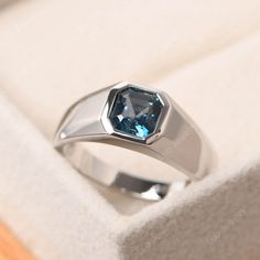 This ring features a 6*6mm asscher cut natural london blue topaz and sterling silver finished with rhodium. Customization is available. It is made by hand, and it will take about 7 days to finish the ring after your payment is completed. It include the lab emerald ring and the band. Main stone: natural london blue topaz Main stone weight: Approx 1.40 ct Metal type: sterling silver finished with rhodium/14k white gold/14k rose gold/14k yellow gold Accent stone: none Customization is available, I Engagement Ring Men Silver, Silver Ring Mens, Men’s Engagement Rings Silver, Silver Stone Rings For Men, Silver Rings Men, Pukhraj Ring, Engagement Ring Men, Mens Sapphire Ring, Rings With Stones