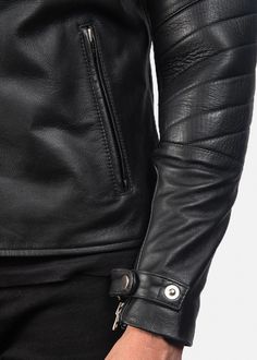 When you place a classic style with a contemporary set of details, you get a pretty cool Raiden Black Leather Biker Jacket. From it's incredible make, using a semi-aniline finished cowhide leather, to having a quilted viscose lining a notch collar and zipper closure. You can't miss the riveting detail that starts with the snap button strap highlighting the cuffs, the subtle yet structural quilting along the elbows and the overall craftsmanship that makes this piece a style essential. Luxury Men's Biker Jacket With Zip Cuffs, Luxury Sleek Leather Biker Jacket, Luxury Black Biker Jacket With Zipper Closure, Luxury Leather Biker Jacket With Metal Zipper, Maroon Leather Jacket, Brown Leather Coat, Black Leather Biker Jacket, Luxury Leather-lined Men's Biker Jacket, Maroon Leather