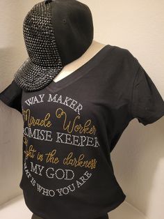 🔥WAYMAKER, MIRACLE WORKER CHRISTIAN SHIRT🔥 This christian faith rhinestone shirt v neck fitted with clear and gold stones. This design comes on v neck fitted cotton black shirt. Material cotton with 95% cotton and 5% spandex. great quality shirts. See the measurement below are across the chest areas and the shirt sizes. Fitted v neck sizes small - 15' (0-6) medium - 16" (6-8) Large - 17"( 8-10) XL - 18" (12-14) 1x - 21 (14-16) 2x - 23"(18-20) 3x' 26"(22-24) V neck Tee - material is cotton come Fitted Black T-shirt With Rhinestones, Black V-neck Tops With Rhinestones, Black V-neck Top With Rhinestones, Fitted V-neck Top With Rhinestones, Waymaker Miracle Worker, Rhinestone Shirt, Rhinestone Shirts, Christian Shirt, Clear Stone