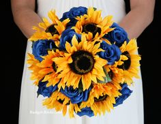 a bridal bouquet with sunflowers and blue roses