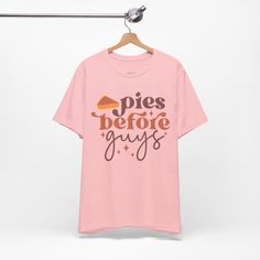 a pink t - shirt that says pies before guys