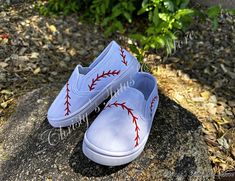 These shoes have been 100% Hand painted! Please see Shipping notice below! Be the best baseball fan you can be! Sport these cute, hand-painted tennies and hat at any game, supporting any team! These super cute tennies have been hand-painted with basic acrylic paint in the shape of baseball laces. The laces are added to all sides of the tennis shoe as you can see. Each lace is delicately finished with a coat of mod podge to seal them for longevity.  Also featured is the most adorable  matching ha Hand Painted Tennis Shoes Ideas, Painted Baseball Shoes, Baseball Chants, Painted Tennis Shoes, Baseball Diy, Baseball Designs, Baseball Painting, Baseball Crafts, Painted Canvas Shoes