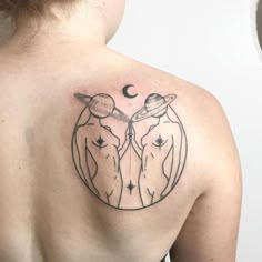 a woman with a tattoo on her back that has two cows in the middle of it