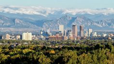 the city is surrounded by mountains and trees