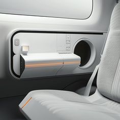 the interior of a car with an electronic device in it's center console and seat belt