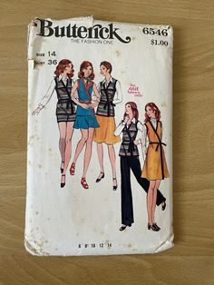 an old butterick sewing pattern on a wooden surface