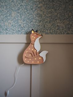 Discover the magic of sleep with our handmade Wooden Fox night lamp Bring a touch of enchantment to your child's room with our beautifully crafted wooden fox night lamp. Designed to create a warm and magical ambiance, this lamp is more than just a source of light -- it's a comforting companion that helps your little one drift into a peaceful sleep. A perfect bedtime ritual Imagine a soft, golden glow filling the room, casting gentle shadows and creating an atmosphere perfect for bedtime stories and sweet dreams. Our fox night lamp offers a soothing light that can be easily adjusted to your child's comfort level. Whether it's a gentle nightlight or a brighter glow for evening playtime, the adjustable dimmer ensures the perfect lighting for every moment. Thoughtful features for peace of mind Lamp For Nursery, Nursery Lamps, Baby Lamp, Wooden Fox, Kid Furniture, Childrens Night Light, Lamp For Kids, Bedtime Ritual, Nursery Lamp