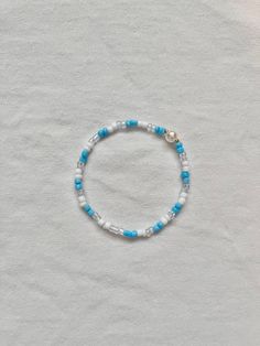 This bracelet is super cute and perfect for spring and summer! Blue Round Beads Bracelet For Spring, Spring Blue Round Beaded Bracelet, Minimalist Round Bead Bracelets For Summer, Beaded Bracelets For Everyday Spring Wear, Trendy Pearl Bracelets With Pearl Charm, Trendy Pearl Charm Bracelets, Minimalist Summer Bracelets With Round Beads, Everyday Beaded Bracelets For Spring, Elegant Blue Bracelets For Spring