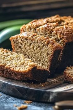 sliced loaf of banana bread on a cutting board with two slices cut off the side