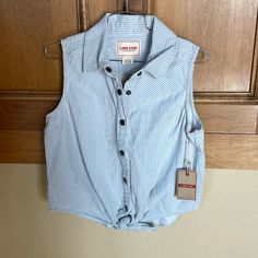 Lone Star Cotton Snap Button Western Sleeveless Top Light Blue And White Vertical Pin Striped, Hem Tie Silver Snap Button Down New With Tag, But One Small Ink Spot On Back Of Collar. Not Noticeable From Afar Smoke And Pet Free P2p 19” Length 21” Sleeveless Tops With Snap Buttons For Spring, Sleeveless Spring Tops With Snap Buttons, Blue Cotton Buttoned Tank Top, Denim Button-up Top With Snap Buttons, Snap Button Button-up Tops For Rodeo, Denim Blue Western Button-up Tops, Blue Button-up Top With Snap Buttons, Denim Blue Snap Button-up Tops, Womens Flannel Shirt