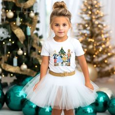 Celebrate Christmas in style with our adorable Nutcracker shirt. This fun shirt comes in a sweatshirt or t-shirt and is perfect for your little one's Christmas and winter festivities. Get your little one ready for the holiday with this eye-catching graphic tee! 🌟 Product Details: Design: Colorful ballerinas, presents, mouse knight, nutcracker, Christmas tree, and presents Style: Unisex short-sleeve t-shirt or crewneck sweatshirt Sizes available: 2T-5T & YS-Y2XL (Please refer to the size chart f Toddler Christmas Sweatshirt, Mouse Knight, Christmas Tree And Presents, Nutcracker Shirt, Nutcracker Christmas Tree, Holiday Graphic Tees, Toddler Size Chart, Christmas Tee Shirts, Christmas Tree Decorations Diy