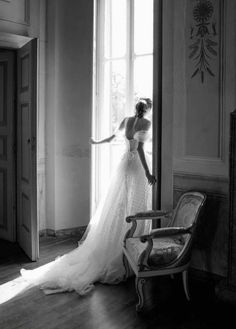 black and white photo of woman in wedding dress