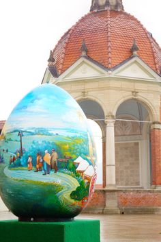 an egg is on display in front of a building