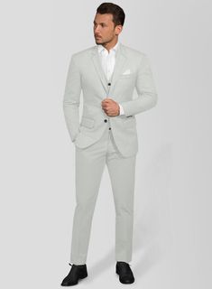 Upgrade your upscale look with the luxe style and comfort of our Light Gray Feather Cotton Canvas Stretch suit. Crafted from cotton lycra blend, the suit is perfect for a man who wants to look his best at any special occasion. Wear it with a matching waistcoat, a crisp white shirt, black tie and polished black dress shoes.   Look Includes  Light Gray Feather Cotton Canvas Stretch Fabric  Two Button Jacket Style  Notch Lapel  Horn Royal Black Buttons  Single Vent  Three Cuff Buttons  Two Welted B Semi-formal Fitted Cotton Sets, Fitted Cotton Sets With Notch Lapel, Fitted Cotton Set For Semi-formal Occasions, Luxury Cotton Suits With Notch Lapel, Tailored Cotton Business Sets, Fitted Cotton Formal Set, Fitted Cotton Sets For Formal Occasions, Modern Fitted Suit With Single Button, Cotton Single Button Suit For Business Casual