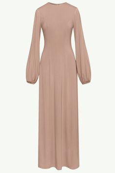 Indulge in luxury with our Hayat Jersey Princess Seam Maxi Dress in Mink. With effortless flow and elegant balloon sleeves, this elevated basic features sophisticated princess seam detailing. Dress it up or down to make it the perfect statement piece for any occasion. Model is 5'7" and is wearing XS/58". Islamic Aesthetics, Royal Outfit, Outfit Concert, Jersey Hijab, Mode Abaya, Hijabi Style, Timeless Wardrobe, Royal Outfits, Muslimah Fashion Outfits