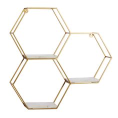 three hexagonal shelves with gold metal frames