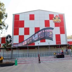 a large building with red and white checkered walls