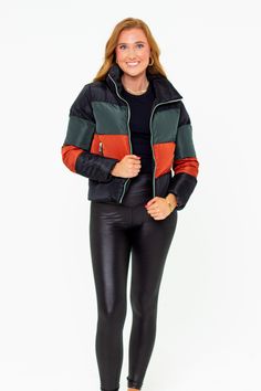 Puffer Jackets don't get more stylish than this! The Addison is the perfect addition to your winter coat collection! She features a zip up and snap closure, a color-block design, and two side pockets! Pair her with leggings, bodysuit, and sneakers for a cute on-the-go look! Product Details: Fit: The Addison Jacket fits true to size. Length: The small measures 23.5" from shoulder to hem. Bust: Accommodating to most bust sizes. Waist: Relaxed fit Fabric: ﻿Fabric does not contain stretch. Material: Winter Sporty Outerwear With Zipper Closure, Sporty Winter Outerwear With Zipper Closure, Fall Outerwear With Contrast Color For Outdoor, Fall Outdoor Outerwear With Contrast Color, Sporty Puffer Jacket For Cold Weather, Fall Outdoor Color Block Outerwear, Black Nylon Puffer Jacket For Fall, Fall Patchwork Long Sleeve Puffer Jacket, Casual Outerwear With Contrast Color For Fall