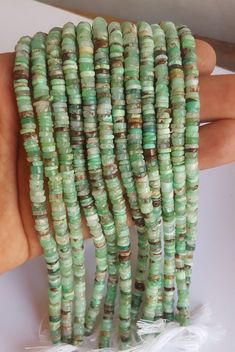 "PRODUCT DESCRIPTION :-- Natural chrysoprase Wheel Beads for making jewelry  Stone Name :-- Natural chrysoprase  Gemstone Shape:-- Wheel (Smooth)   Quality:--- AAA+  Length :-- 8\"Inches Approximate  Color :-- Green  Size :-- 5-6 MM Our Quality Grade are AA, AAA,AAA+   Delivery timeframes (from date of shipping)  USA: ~2 weeks   Rest of the World: ~ 3-4 weeks The photographs of the items have been taken in natural daylight, without any enhancements or affects and all attempts have been made to depict the colour of the gemstones accurately. Due to the use of natural gemstones, gemstone colours may vary slightly.   Each gemstone is hand selected to ensure only the most precious, unique and luxurious gemstones are used in our jewellery . Most items are shipped directly from Australia. However Green Rondelle Beaded Bracelets With Polished Beads, Handmade Green Beaded Bracelets With Oval Beads, Green Spacer Beads For Crafting, Green Heishi Beads Round Beaded Necklace, Green Polished Beads For Jewelry Making, Green Spacer Beads For Jewelry Making, Green Heishi Bead Jewelry With Gemstone Beads, Green Chrysoprase Beaded Necklaces, Handmade Chrysoprase Beaded Necklaces With Round Beads