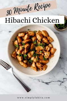 a white bowl filled with chicken on top of a table