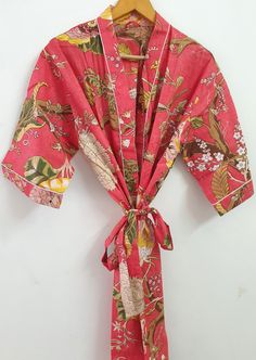 Pink floral kimono robe, Indian handmade kimono kaftan, free size kimono bath robe, pure cotton kimono robe, women night maxi, Indian kimono  Material cotton Size One size (plus) US women's letter Product: 1 PC Floral Printed Cotton Kimono Cotton Kimono made From Hand block Printed Fabric.It is hand printed fabric using natural dyes. Measurements or Sizes: Length- 52 Inches Bust-48 inches Sleeve-14 inches  Size: Free Size Kimono Main Color: - Pink  Pattern :- Floral  Note: The color and brightne Honeymoon Robe, Cotton Pajama Set Women, Bath Robes, Kimono Floral, Block Printed Fabric, Floral Print Kimono, Hand Printed Fabric, Printed Robe, Cotton Kimono