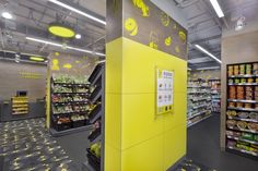 the interior of a grocery store with yellow accents