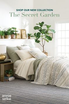 a bed room with a neatly made bed and potted plants