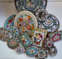 an assortment of decorative plates and bowls