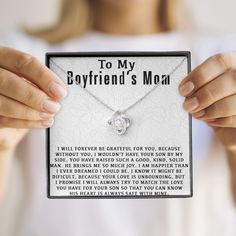 a woman holding up a card that says to my boyfriend's mom