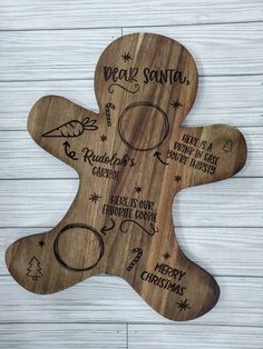 a wooden christmas ornament with the words dear santa written on it