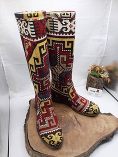 This is handembroidered custom made vintage boots. Very special vintage needle work suzani. Outside of boots from uzbekistan unique vintage fabric, covered by natural leather. Material : Vintage tapestry, genuine leather. Every size available. Custom made, if you need wider calf size please let us know your calf circle size. To make custom order NO extra charging. Your boots will be very smilar to photo but maybe not very same. Knee high boots. Riding style. Very comfy and useful. We have door t Handmade Bohemian Festival Boots, Traditional Handmade Brown Boots, Handmade Traditional Brown Boots, Bohemian Knee-high Boots For Festivals, Traditional Embroidered Boots For Festival, Traditional Embroidered Festival Boots, Traditional Multicolor Embroidered Boots, Vintage Handmade Boots With Round Toe, Handmade Vintage Boots With Round Toe