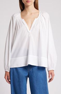 Free-flowing and billowy, this cotton peasant top will complement your casual look with happy vibes. Split neck Long sleeves 100% cotton Machine wash, tumble dry Made in the USA Flowy Cotton V-neck Blouse, Billowy Cotton Top For Day Out, Effortless Cotton Blouse For Fall, Flowy Relaxed Tops For Spring, Billowy Tops For Daywear In Fall, Relaxed Fit Cotton Blouse For Daywear, Billowy Tops For Fall Daywear, Relaxed Fit Cotton Peasant Top For Day Out, Billowy Cotton Blouse For Fall