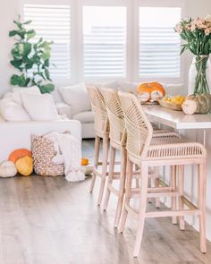 the instagram page for instagram is displayed with chairs and flowers in vases