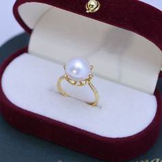 10-11mm Freshwater Edison Pearl CZ Ring This 10-11mm Freshwater Edison Pearl CZ Ring is crafted with s925 silver and features a sparkling cubic zirconia. Its elegant design makes it a perfect gift for someone special. Product Information Pearl Type Freshwater Pearl Origin China Shape Round Quality AAA Size 10-11mm Nacre Very Thick Color White Luster Very High Elegant Pearl Ring With Cubic Zirconia, Elegant Pearl Ring With Diamond White Cubic Zirconia, Elegant Pearl Diamond Ring For Gift, Elegant Diamond White Pearl Ring With Cubic Zirconia, Elegant Pearl Diamond Ring As Gift, Elegant Yellow Gold Pearl Ring With Cubic Zirconia, Elegant Round Cut Cubic Zirconia Pearl Ring, Luxury Cubic Zirconia Pearl Ring Gift, Luxury Pearl Diamond Ring As Gift