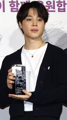 the young man is holding an award for his role in the movie,'i love you