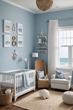 a baby's room with blue walls, white furniture and pictures on the wall