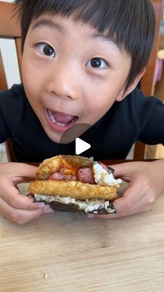 a little boy that is eating some kind of food