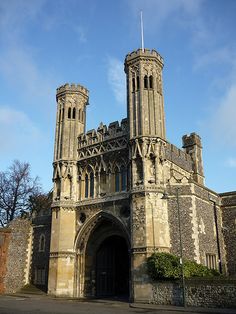 an old building with two towers on the front