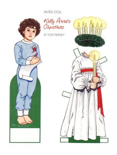 two children's paper dolls with candles on their heads, one boy holding a cross and the other girl wearing a white dress