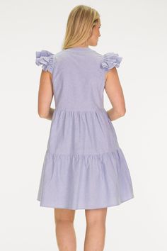 Classic blue oxford meets playful ruffles and tiers in the best selling Jamie Dress! Named for our founder, this dress perfects a balance of classic timeless style with a dash of whimsy. FAVORITE FEATURES: Ruffle sleeve Flattering V-Neckline Tiered Chic Cotton Tiered Dress With Ruffle Hem, Tiered Cotton Ruffle Dress, Blue Tiered Dress With Ruffles For Spring, Cotton Tiered Ruffle Dress, Casual Tiered Ruffle Dress For Daywear, Cotton Tiered Dress With Flutter Sleeves And Ruffles, Casual Cotton Tiered Dress With Ruffles, Blue Cotton Tiered Dress For Spring, Cotton Ruffled Tiered Skirt Dress