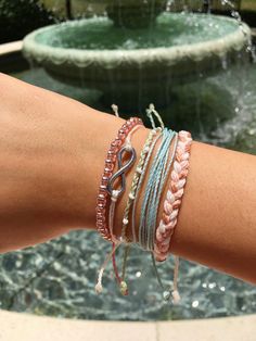 "TIFF&E waterproof bracelets and anklets are perfect for your active lifestyle - wear them anywhere... beach, pool, gym, shower, you name it! Alone or stacked with others, they give an effortless bohemian vibe and wearing them everyday will only enhance the natural look and feel. Each TIFF&E item is: -handmade with meticulous attention to detail using high quality waterproof waxed polyester string -adjustable using our unique minimalist sliding knot -super cute and fun when stacked with Summer Friendship Bracelets In Strand Shape, Casual Strand Bracelets For Festival, Summer Strand Friendship Bracelets, Casual Resizable Beaded Bracelets For Beach, Resizable Pink Friendship Bracelets For Summer, Pink Resizable Friendship Bracelet For Summer, Resizable Pink Friendship Bracelet For Summer, Casual Summer Braided Strand Bracelets, Casual Pink Braided Bracelets