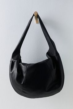 Carry it all in this so cool bag featured in a slouchy, crescent-style silhouette and stunning vegan leather fabrication to add a luxe touch to any look. **Features:** Oversized design, crescent style, vegan leather fabrication, fully lined interior, zip top closure, interior pocket **Why We ❤ It:** Just as cool as it is classic, this goes-with-anything bag is sure to be a staple in your accessories collection for many years to come. | Slouchy Carryall Bag by FP Collection at Free People in Blac Crescent Shoulder Bag, Black Slouchy Bag, Slouchy Shoulder Bag, Leather Slouch Bag, Oversized Shoulder Bag, Slouchy Tote Bag, Black Hobo Bag, Cool Bags, Daily Fits