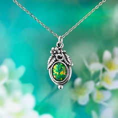 Beautiful, luminous, Golden Green fire opal ( created opal) necklace. Featuring the intricate nature style Art Nouveau design. Hand made by artists in our studio. Size of opal 8 x 10  mm, setting size 10 x 14 mm Includes dainty but strong adjustable stainless steel chain. Measures from 18 to 19.5 inches or 50 cm with extension. It's a perfect standard length. If you require a longer or shorter chain, please let us know. About Sky Royal Studios Created Opal: We only use the finest gem quality Cre Fire Opal Green Necklace, Design Art Nouveau, Australian Gifts, Green Fire, Fire Opal Necklace, Art Nouveau Design, Natural Style, Jewelry Cleaner, Wedding Jewellery Necklace